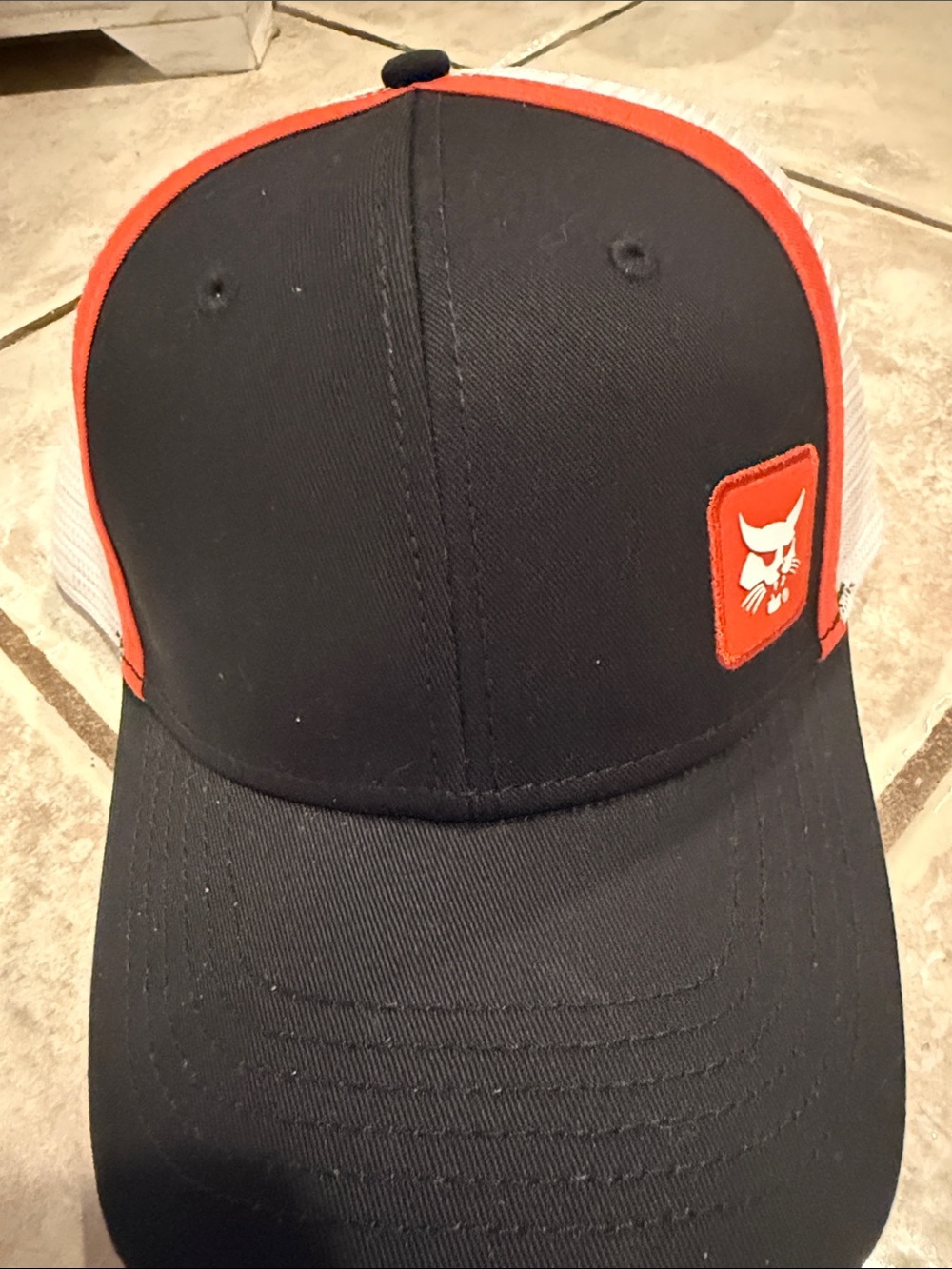 Bobcat Black and White Mesh Trucker Hat with Umbrella Logo